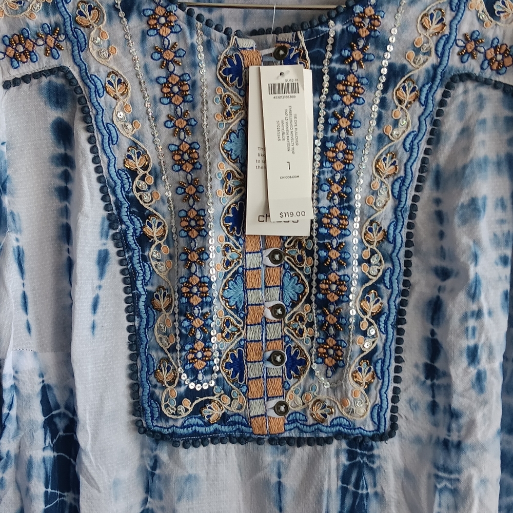 Chico's size 1 or large white and blue shirt with tribe designs..
